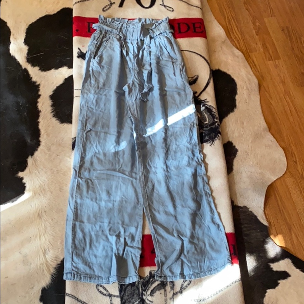 Flowy denim color pants.